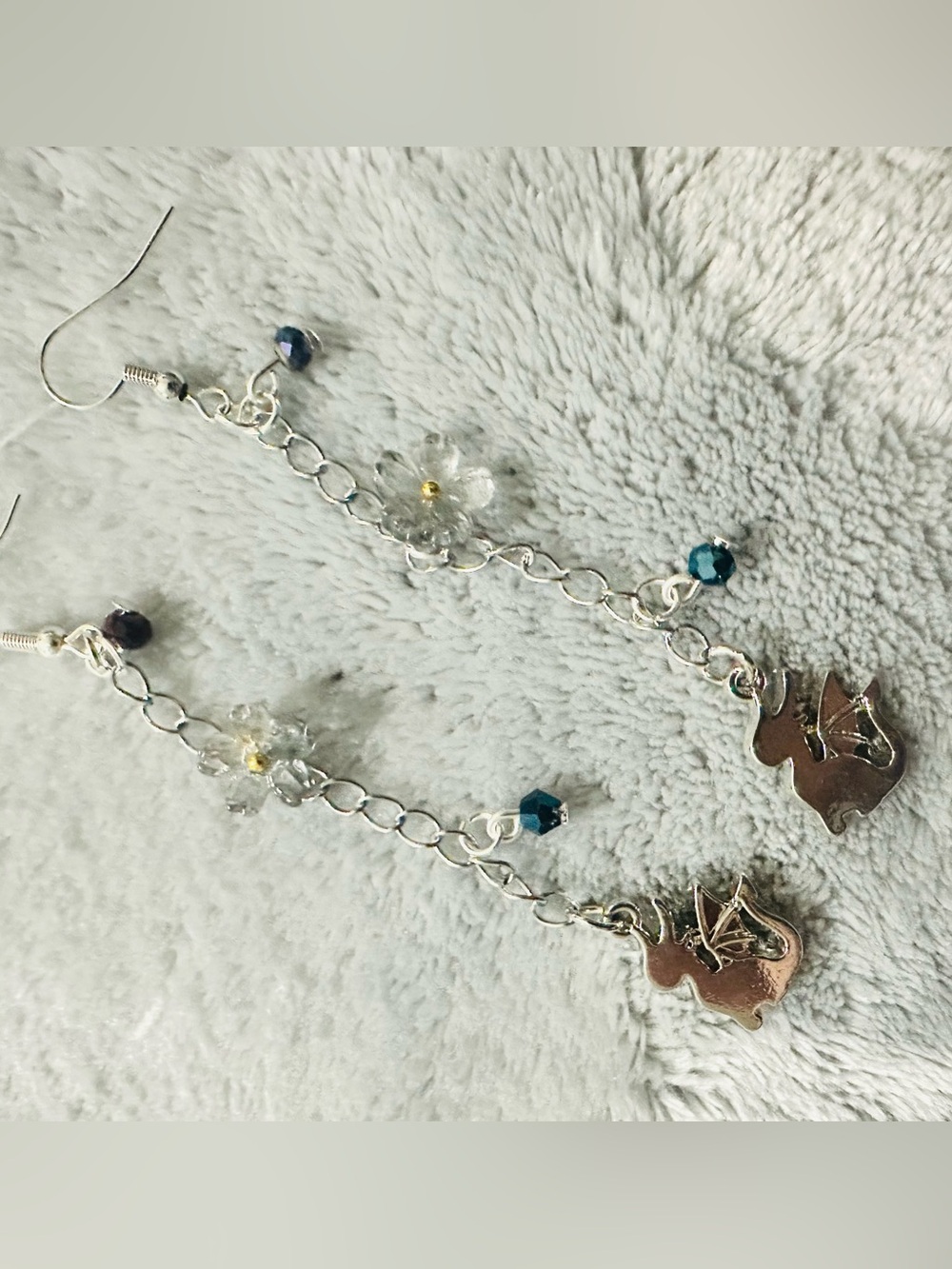 Silver Tone Floral and Dragon Drop Earrings with Blue Crystal Accents